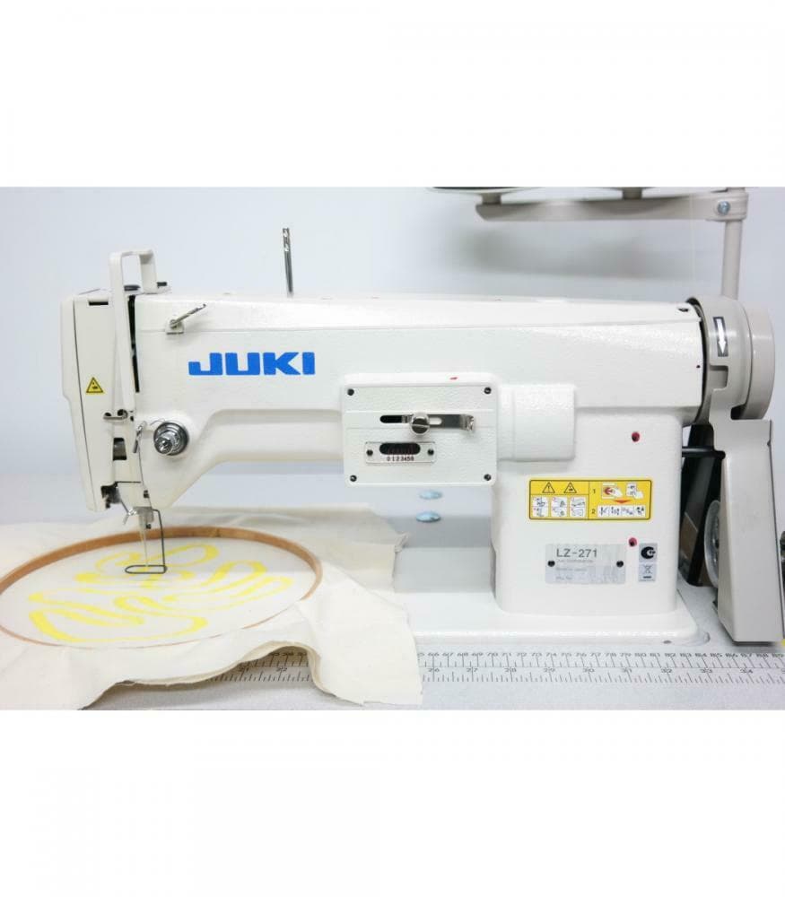 Industrial embroidery machine stitching the velora logo